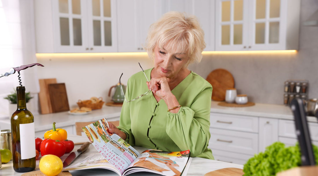 Woman reflecting at kitchen counter about why she has cravings even when not hungry